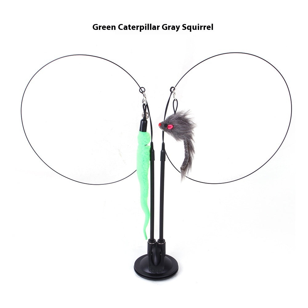 Green caterpillar and gray squirrel plush toys hanging from black wire loops on a suction cup base.