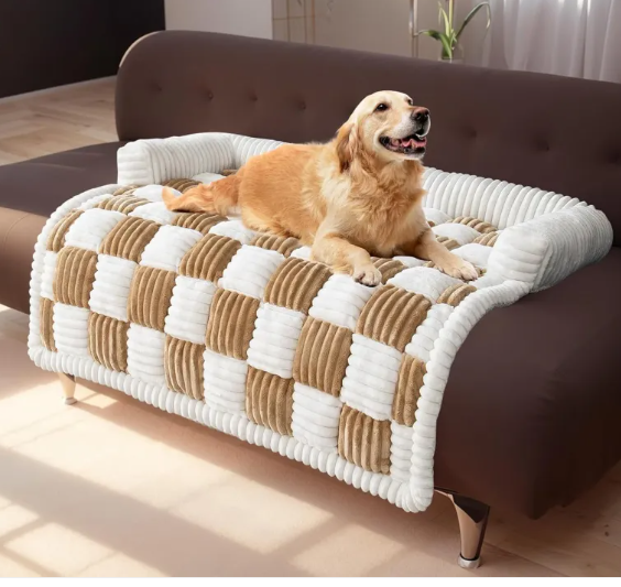 A Golden Retriever rests comfortably on a Creative critters CozyPlush Pet Bed, featuring a brown and white checkered plush design on a sofa.