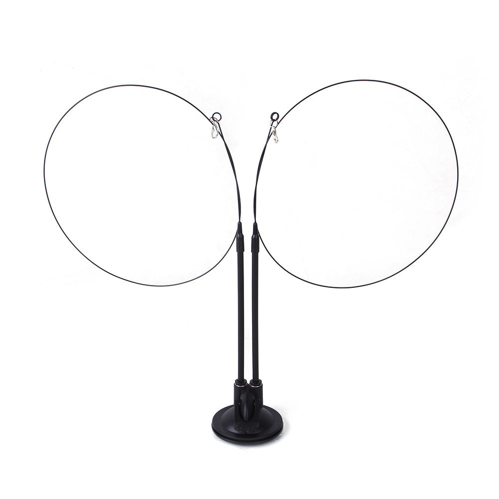 Two black plastic suction cup bases with long, flexible wire wands curved into circles on a white background.