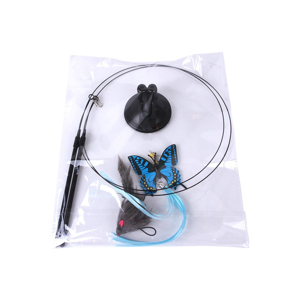Cat teaser toy kit in plastic packaging with a black suction cup, wire wand, blue butterfly, and grey fabric mouse.